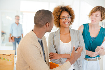 Fototapeta premium Portrait of talking and smiling office workers