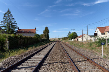 Fototapeta na wymiar Railway track in a Hermé village . La Bassée National nature reserve