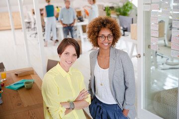 Fototapeta premium Portrait of two smiling office workers