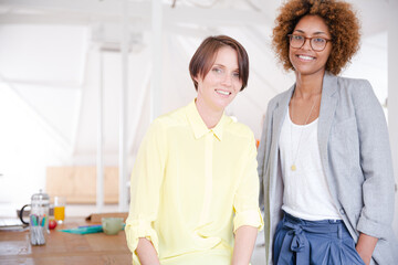 Fototapeta premium Portrait of two smiling office workers