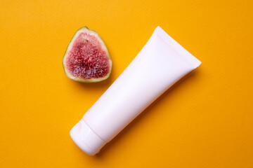packaging of hand or face cream on yellow background