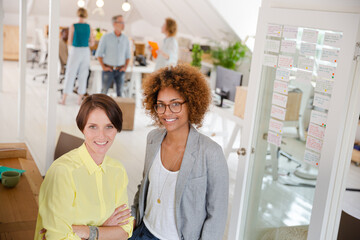 Fototapeta premium Portrait of two smiling office workers