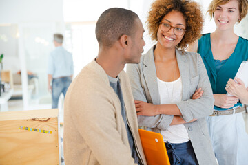 Portrait of talking and smiling office workers