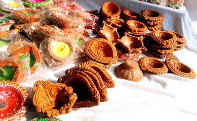 Close up of heap of Indian clay oil lanterns or diya ready to be sold in market during Diwali