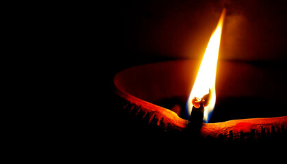 Soil or clay lamp radiating light in dark