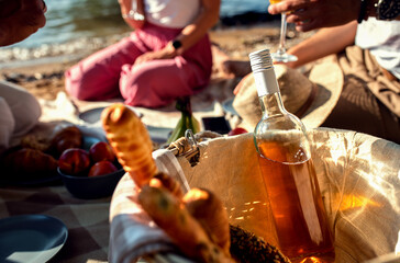 Diverse group of friends enjoying picnic by the river.