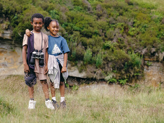 Outdoor portrait of brother and sister embracing in nature © Cultura Creative