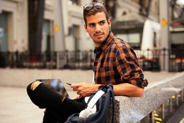 Man shopping online with laptop. Young man buying online with credit card.