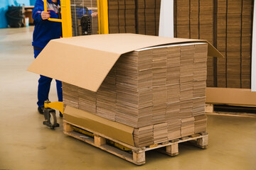Sheets of cardboard are stacked