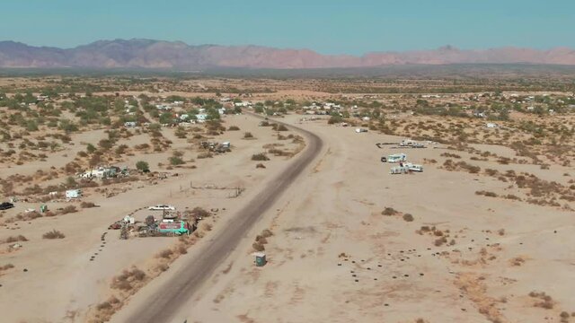 Aerial: Slab City a Dessert town of temporary homes, California, USA