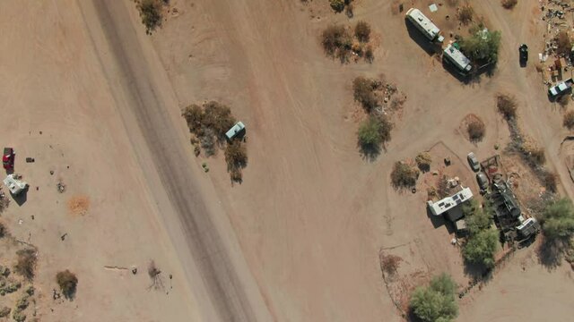 Aerial: Slab City a Dessert town of temporary homes, California, USA