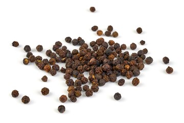 Black peppercorns, isolated on white background.