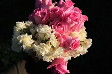 Bunch of pink roses and cream jonquil flowers bouquet