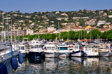 Fototapeta na wymiar Harbor of Golfe-Juan, commune of the Alpes-Maritimes department, which belongs in turn to the Provence-Alpes-Côte d'Azur region of France