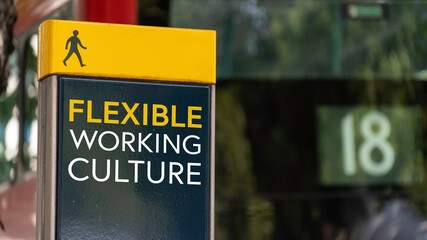 Flexible Working Culture sign in a busy commuter city center