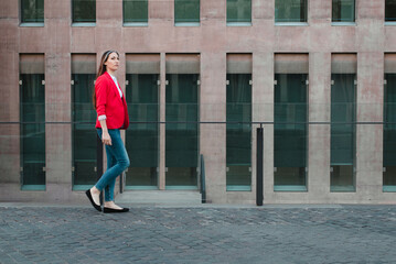 corporate lady walking on city business buildings. Businesswoman following no high heels movement