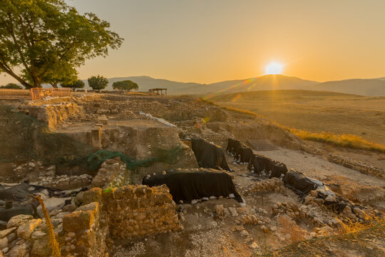 Sunset of ancient Israelite buildings, trees and landscape, Tel Hazor
