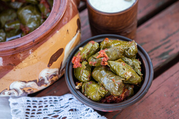 Dolma.Traditional romanian cuisine stuffed cabbage leaves with minced meat and rice in ceramic dish.