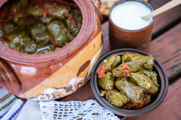 Dolma.Traditional romanian cuisine stuffed cabbage leaves with minced meat and rice in ceramic dish.