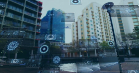 Image of scopes scanning and data processing on screens over cityscape