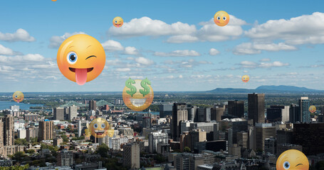 Image of emoji icons flying up over cityscape