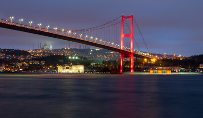 Fototapeta na wymiar Night shot of Bosporus Bridge in springtime. Shot from Ortakoy district, Istanbul Turkey