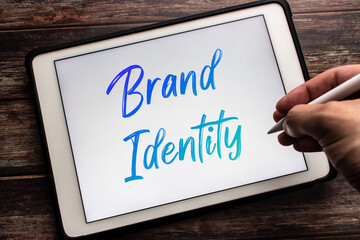 Conceptual closeup keyword Brand Identity on tablet. Define the right image to consumer or clients....