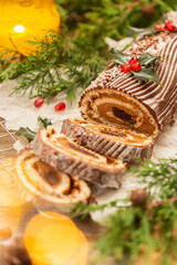 Fototapeta na wymiar Traditional Christmas cake, chocolate Yule log with festive decorations 