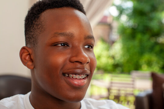 Smiling teenage boy with dental braces