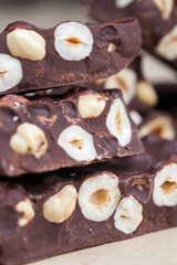 milk chocolate with whole and chunks of hazelnuts