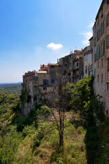 Fototapeta na wymiar View of the exterior of the village with its high facades at Tourrettes-sur-Loup, a commune in the Alpes-Maritimes department in southeastern France