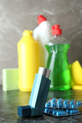 Asthma treatment accessories on black smokey table