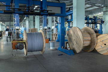 industrial production of fiber optic cable for telecommunication systems. Manufacturing of modern fiberglass and fiber optic cables at the factory.