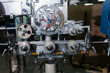 Fiber optic cable production machine, line in a factory in a workshop. Production of fiber optic...