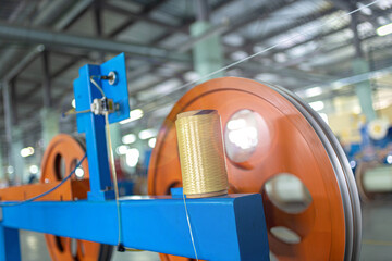 Fiber optic cable production machine, line in a factory in a workshop. Production of fiber optic...