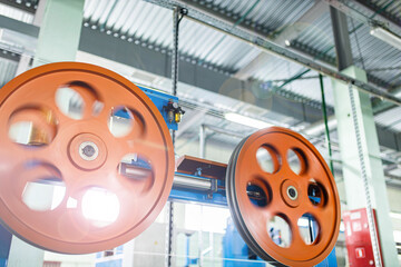 Fiber optic cable production machine, line in a factory in a workshop. Production of fiber optic...