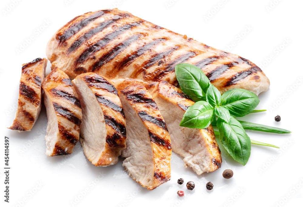 Wall mural grilled chicken fillet with herbs isolated on white background.