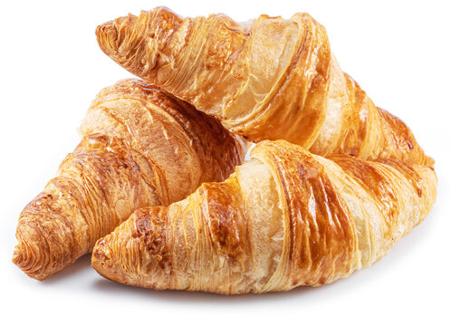 Tasty crusty croissants close-up on a white background.