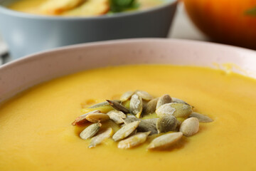 Concept of tasty food with pumpkin soup, close up