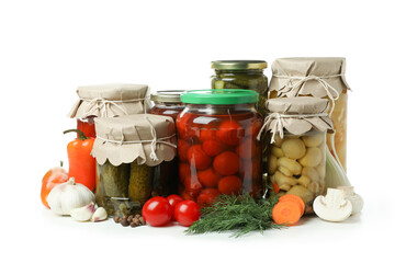 Jars of pickled vegetables isolated on white background
