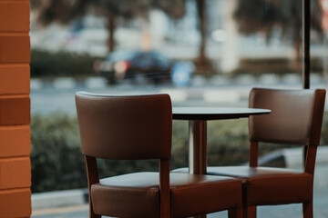 Empty Outdoor Restaurant Cafe with Street View Table and Chairs for Two People