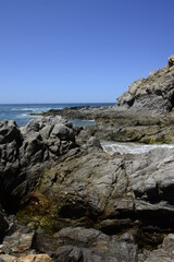 Fototapeta na wymiar Vertical imaga of rocks and ocean waves at the pacific ocean near Todos Santos in the Baja peninsula at Baja california Sur, La Paz Todos Santos Mexico. LOS CERRITOS Beach 