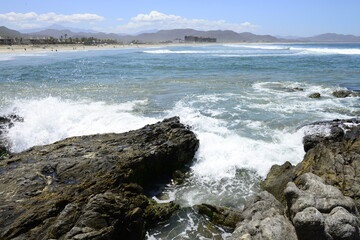 Fototapeta na wymiar Rocks and ocean waves at the pacific ocean near Todos Santos in the Baja peninsula at Baja california Sur, La Paz Todos Santos Mexico. LOS CERRITOS Beach 