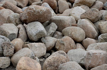 giant pile of rolling stone blocks. boulders for sale. cleaning large rivers with ground stones....