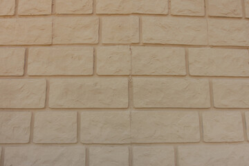 Surface of pale yellow brick veneer wall