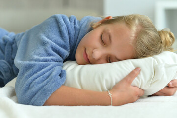 Fototapeta premium Portrait of cute little girl sleeping in bed