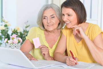 Close up portrait of women showing card shopping online