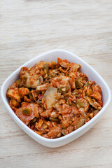 Achar made of green mango on rustic table with copy space