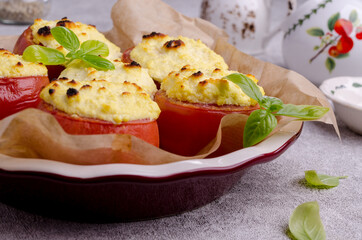 Stewed tomatoes stuffed with cheese
