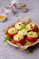 Stewed tomatoes stuffed with cheese